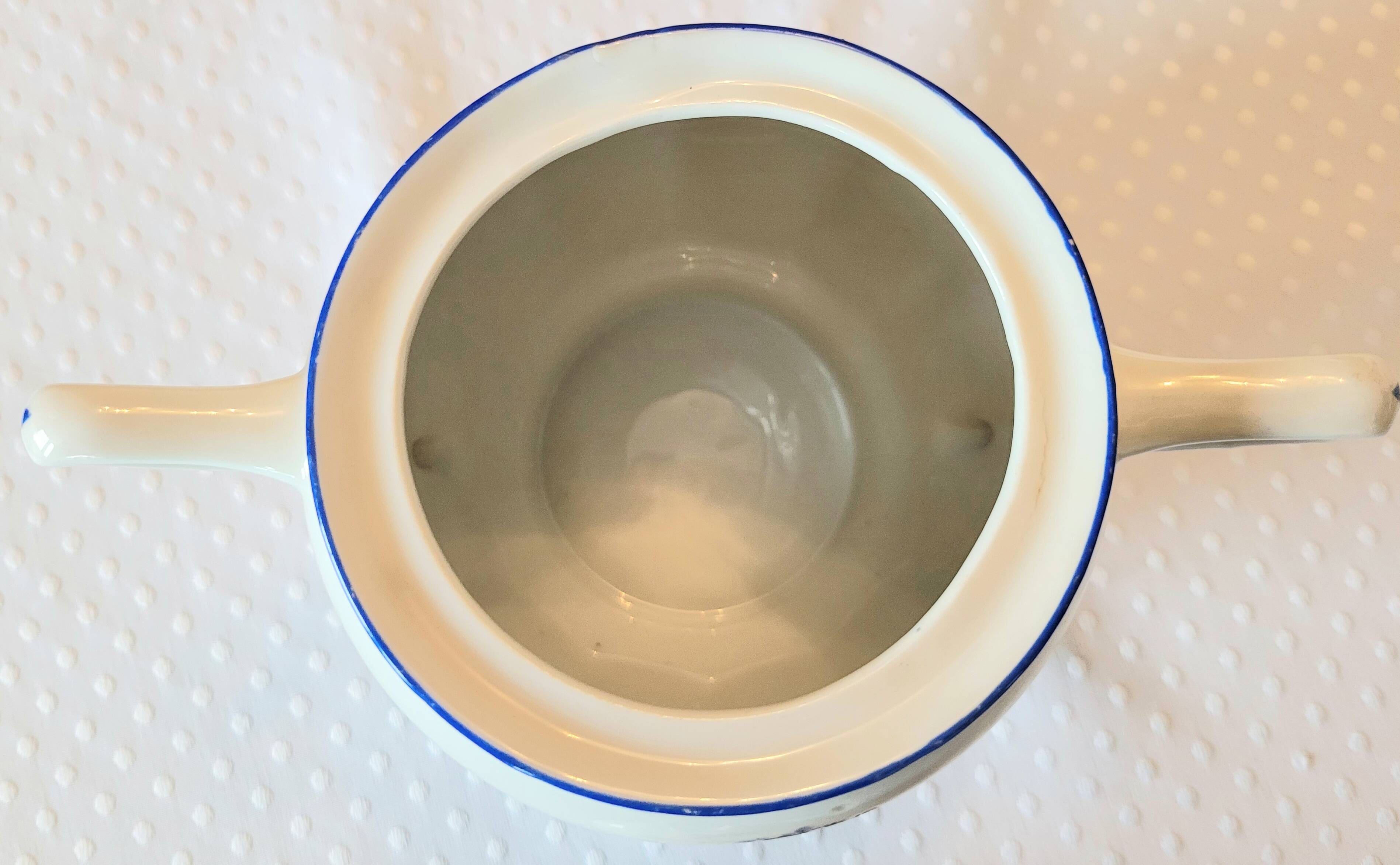 Blue and white ceramic coffee service with flowers.