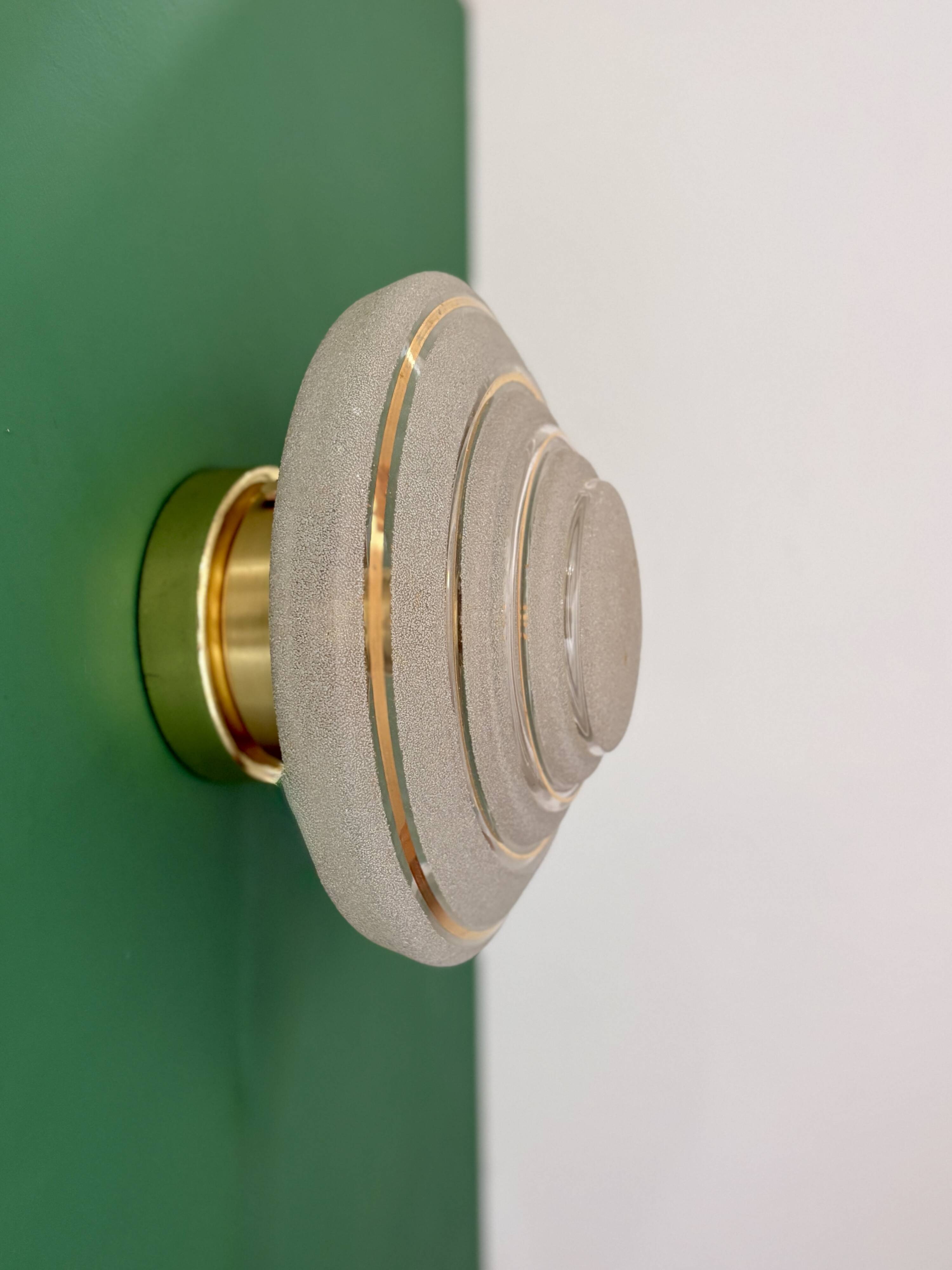 Old glass globe wall/ceiling light in frosted white and gold.