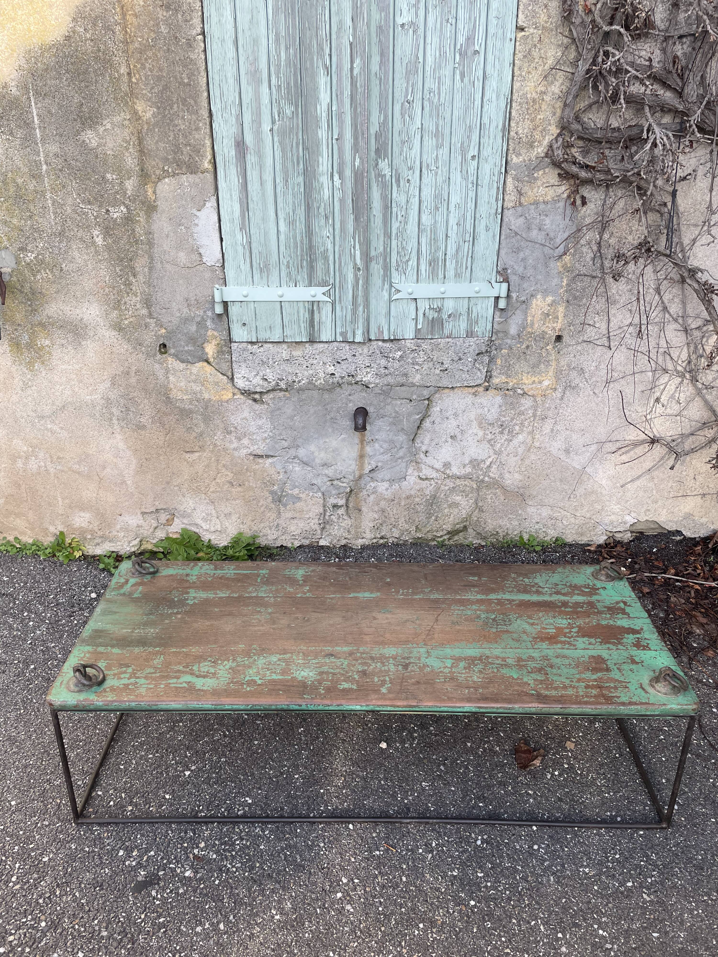Pair of green teak coffee tables.