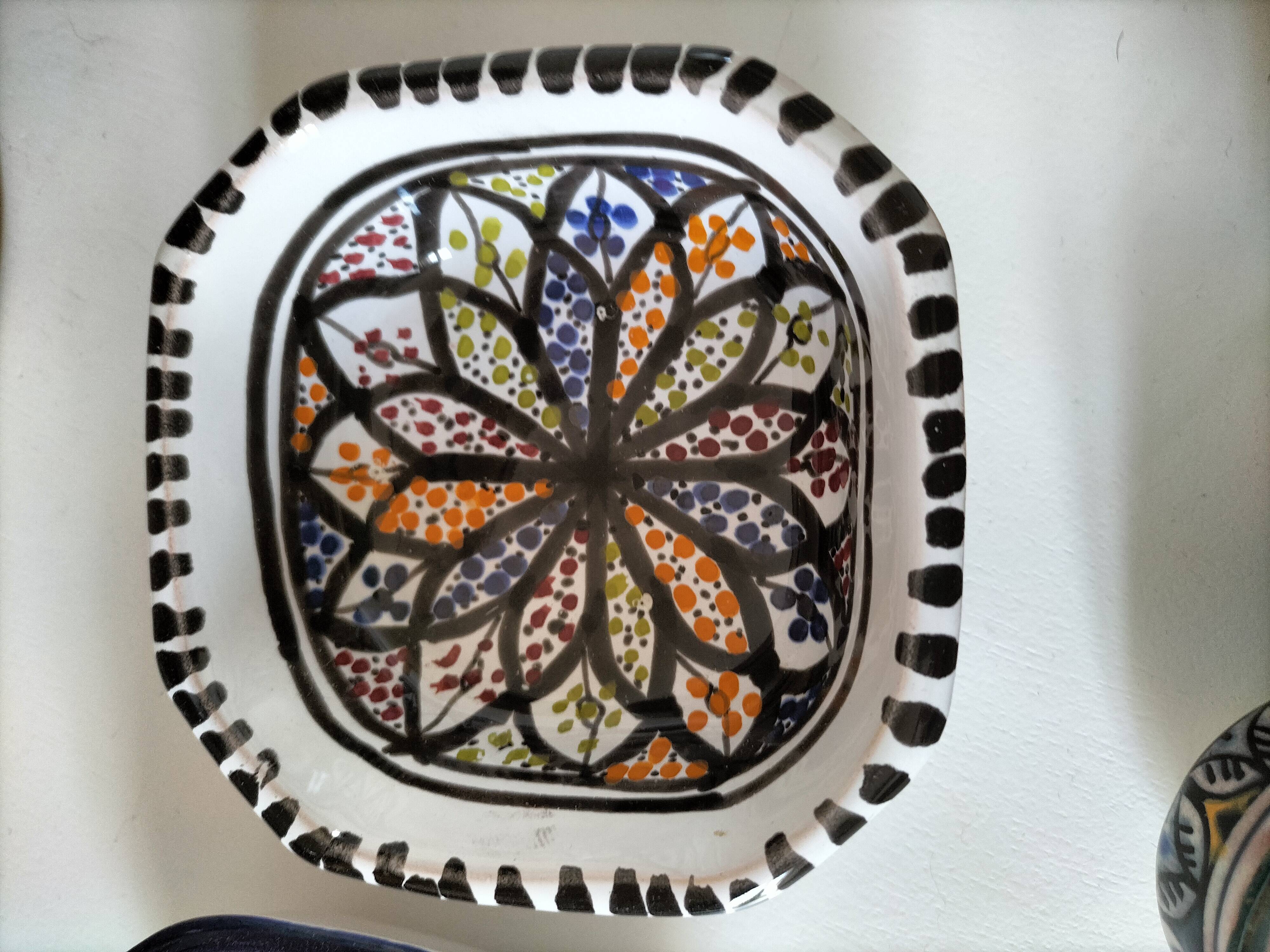 Set of 9 hand-painted Tunisian ceramics.