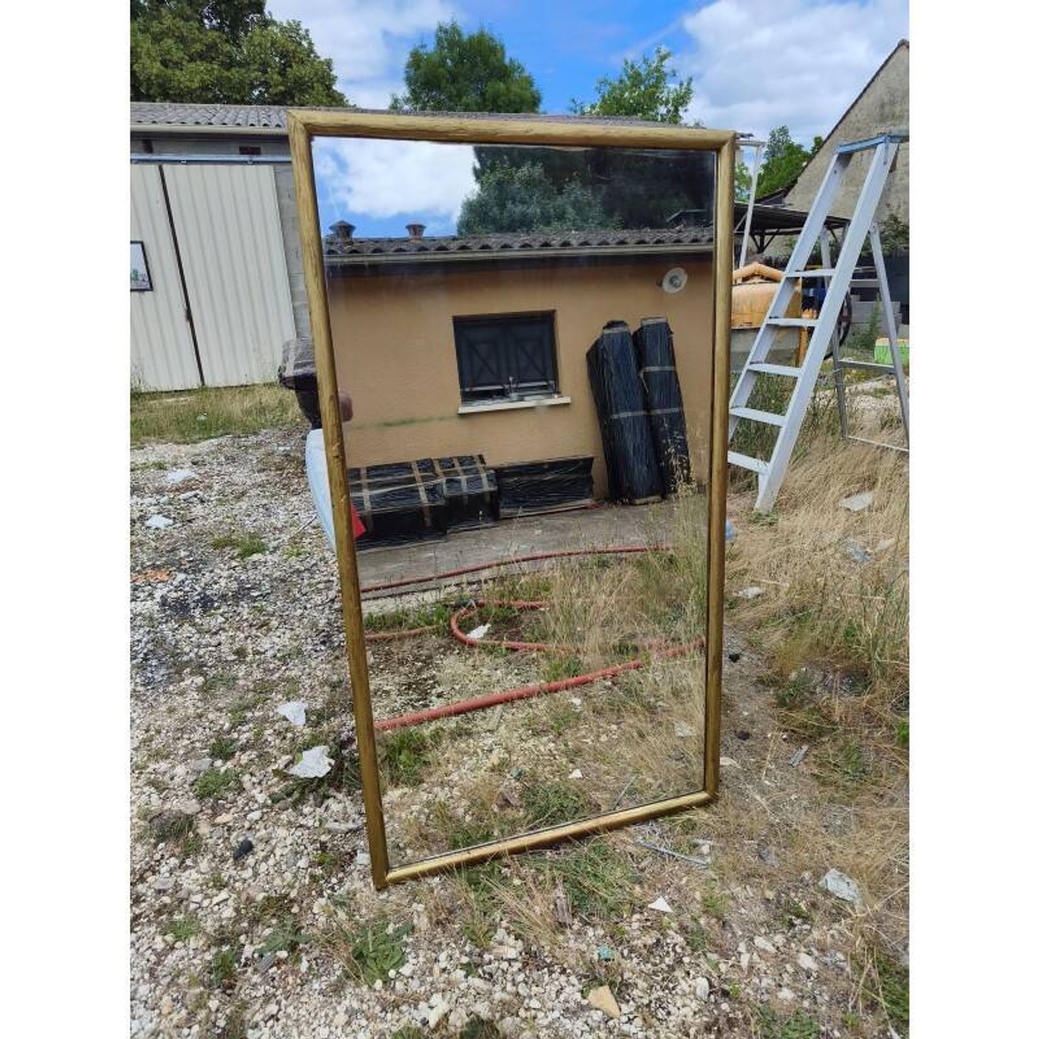 Grand miroir début 20ème bois et stuc doré