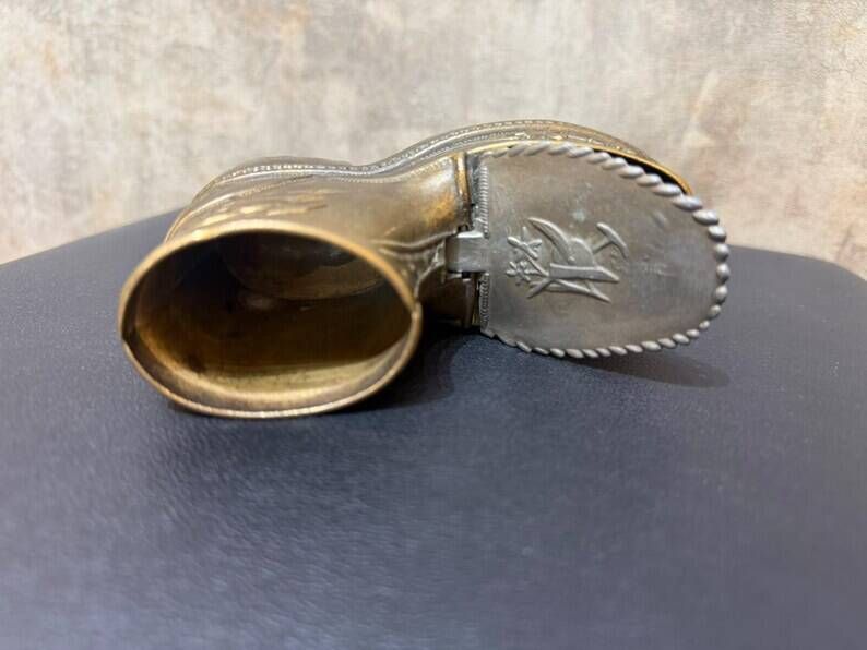 Vintage ashtray in the shape of a hiking boot with a hinged lid