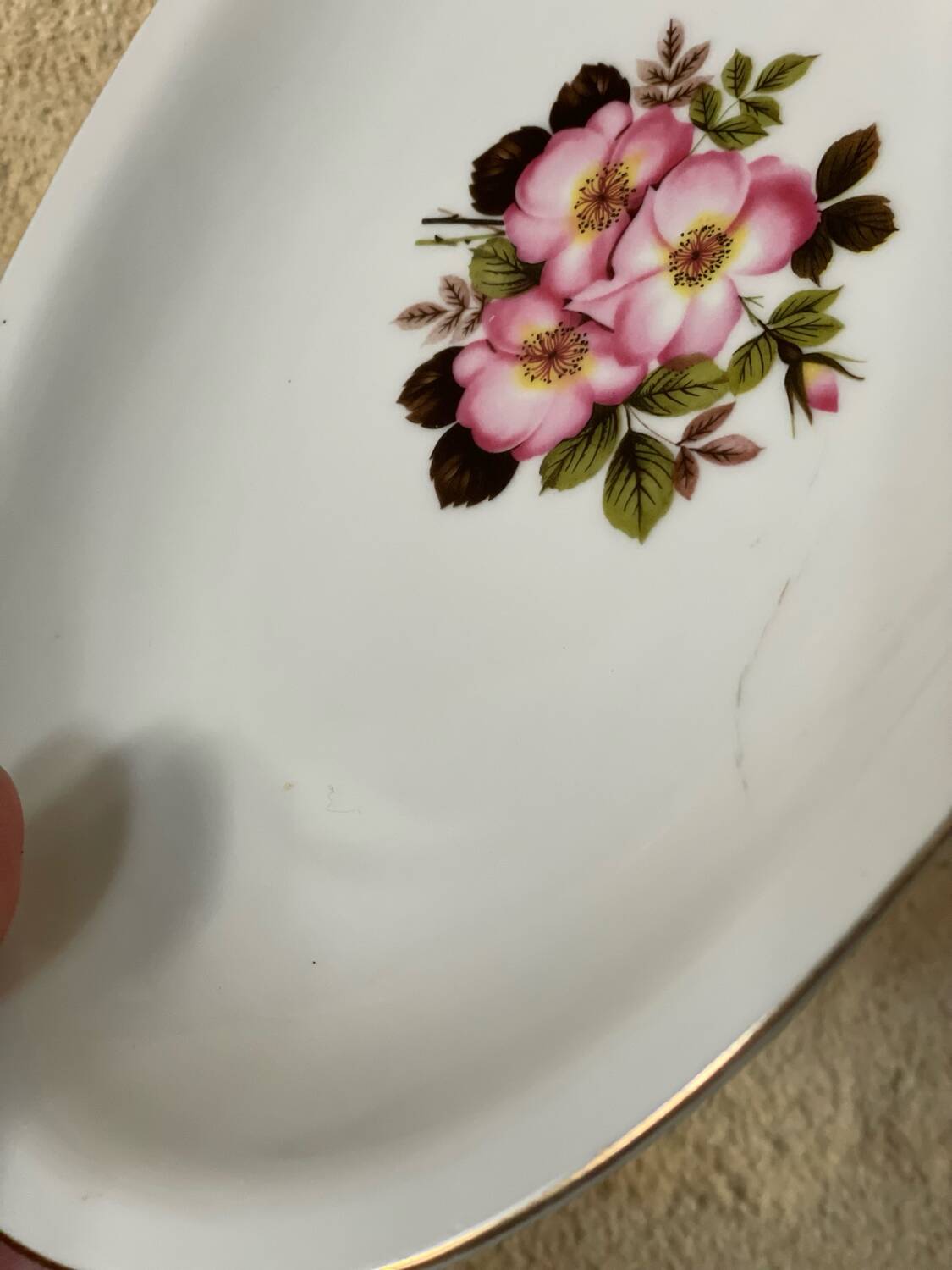 2 oval porcelain dishes with a floral pattern