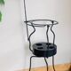 Foldable wrought iron support from the 19th century for a toilet set.