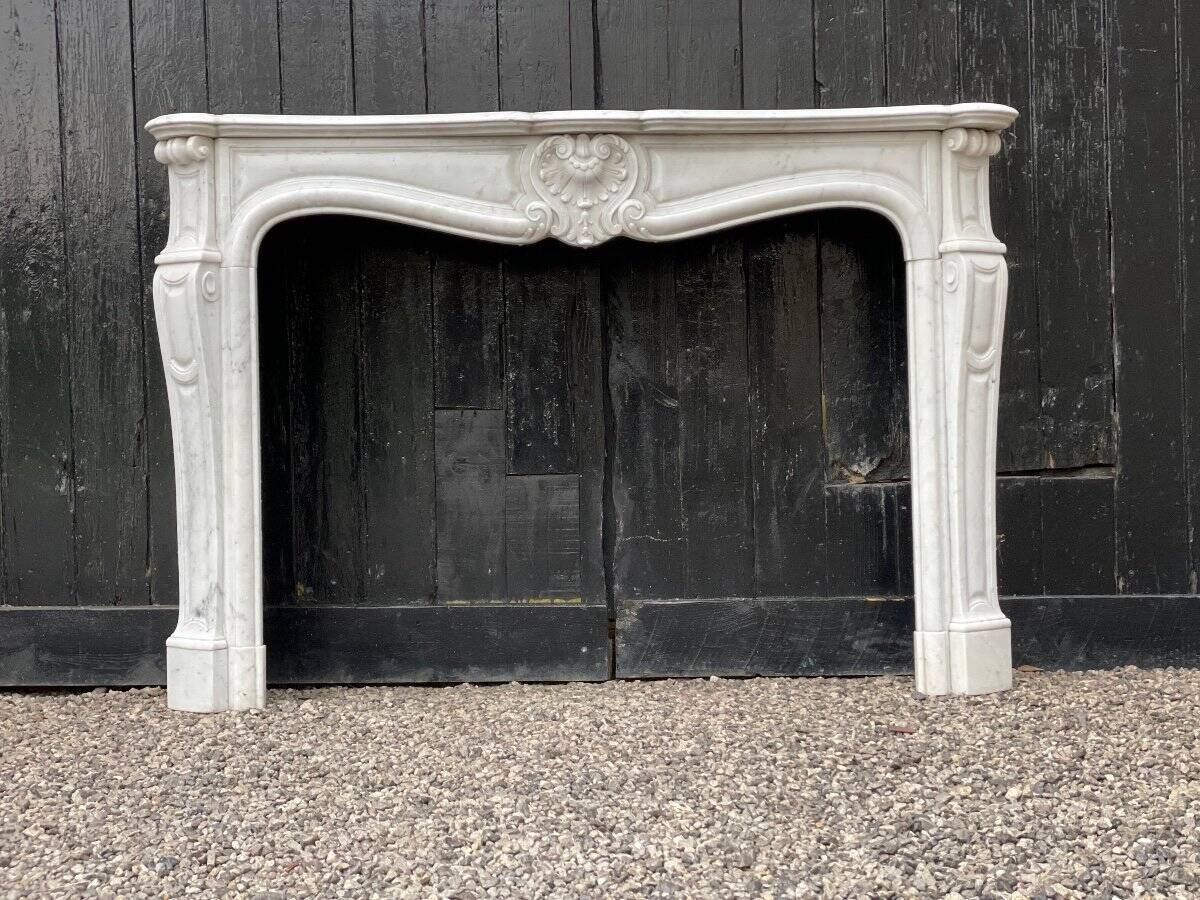 Louis XV style fireplace in Carrara marble