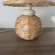 Pair of bedside lamps made of woven sea rush, matching lampshades, 1980.