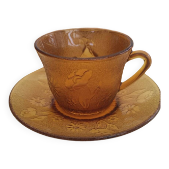 6 amber-colored glass cups and saucers