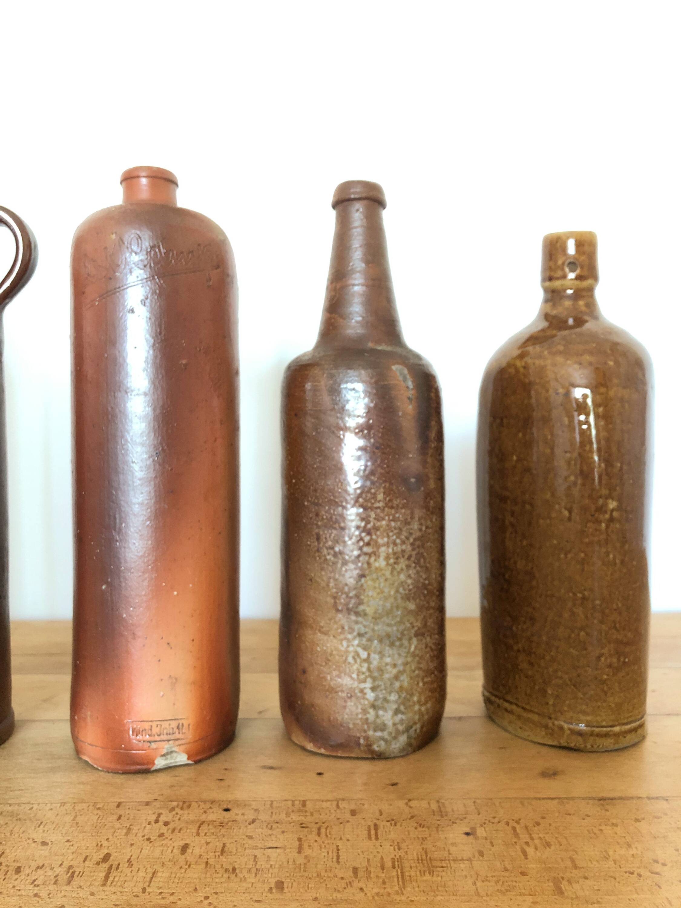 Set of 5 antique glazed stoneware bottles