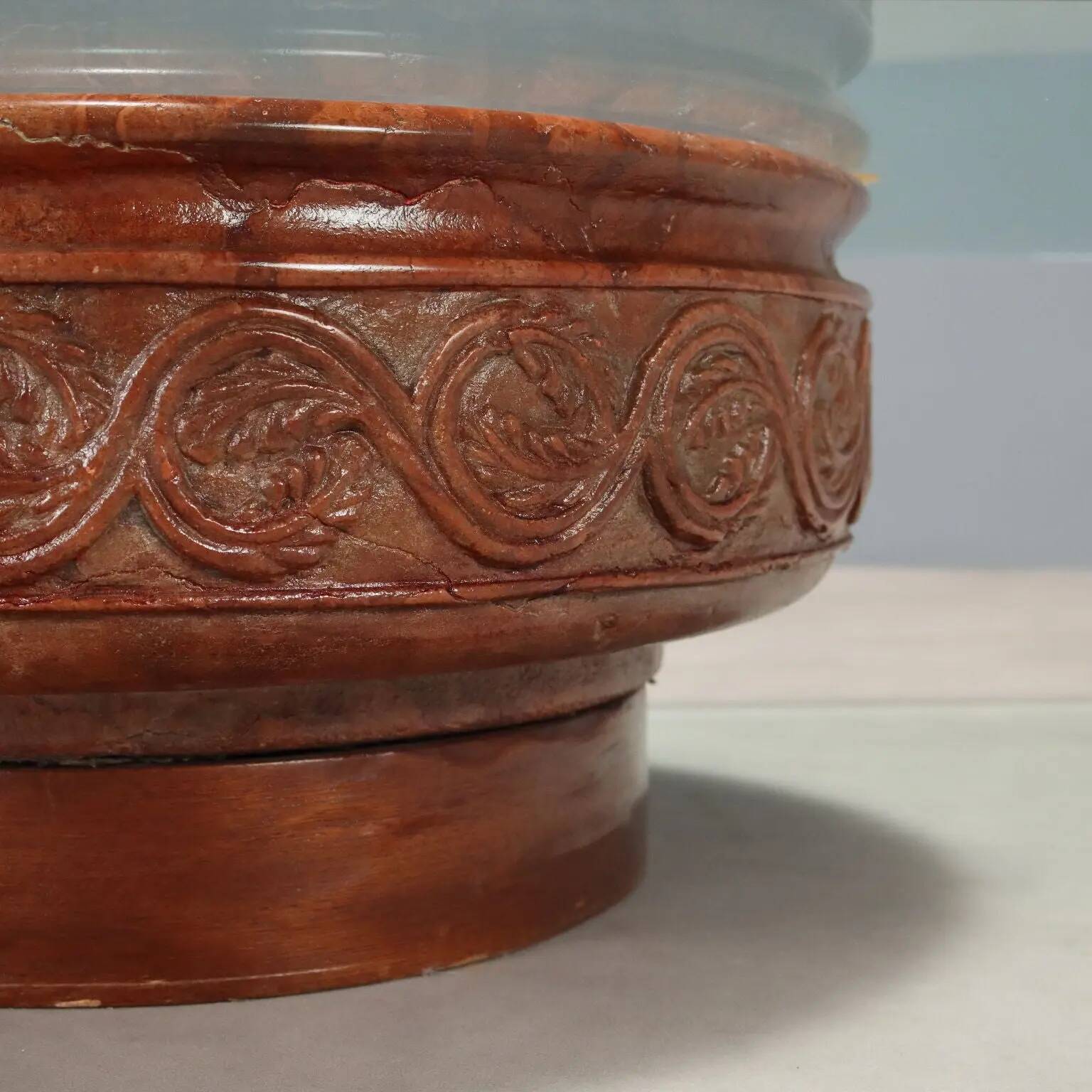 Vintage coffee table with a glass top and a terracotta base, 20th century.