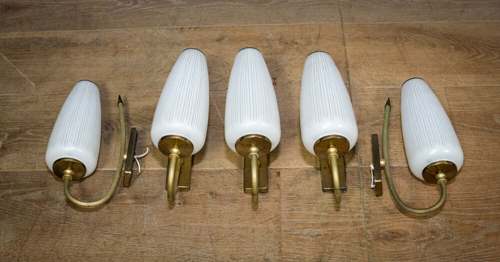 Ornate wall lamp made of milk glass and brass