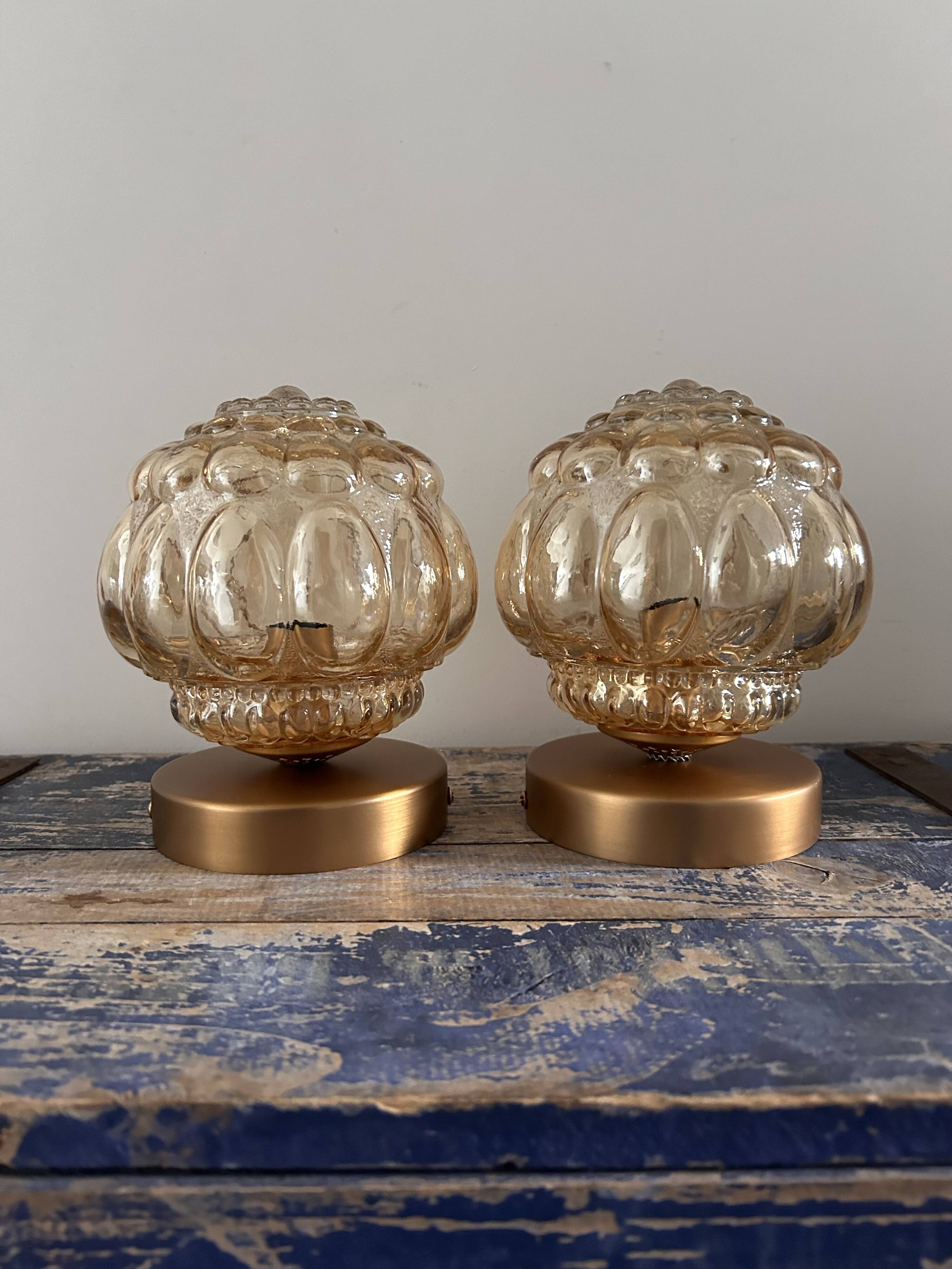 Pair of Scandinavian golden globe wall lights