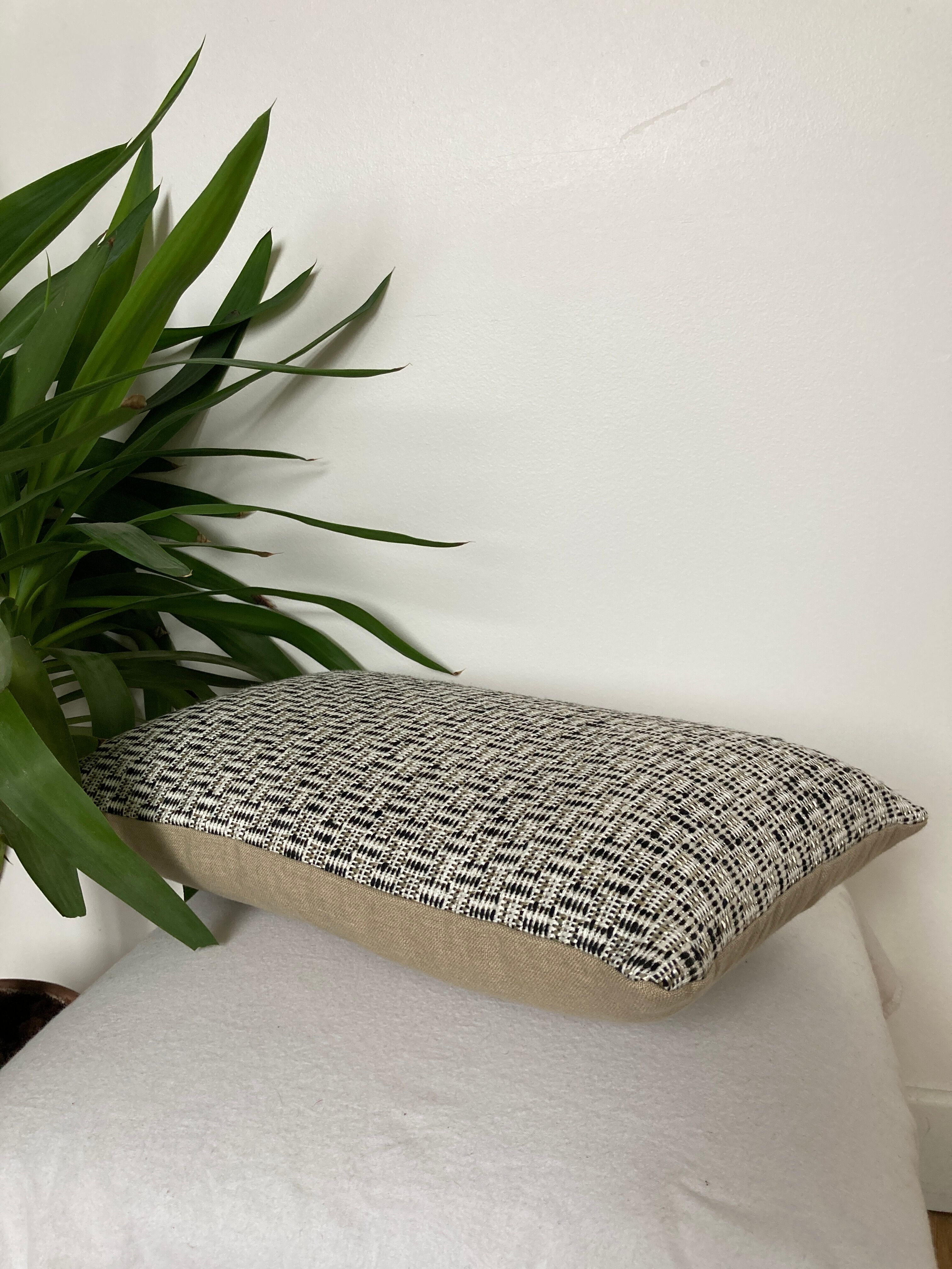 Bi-sided cushion beige black white pattern
