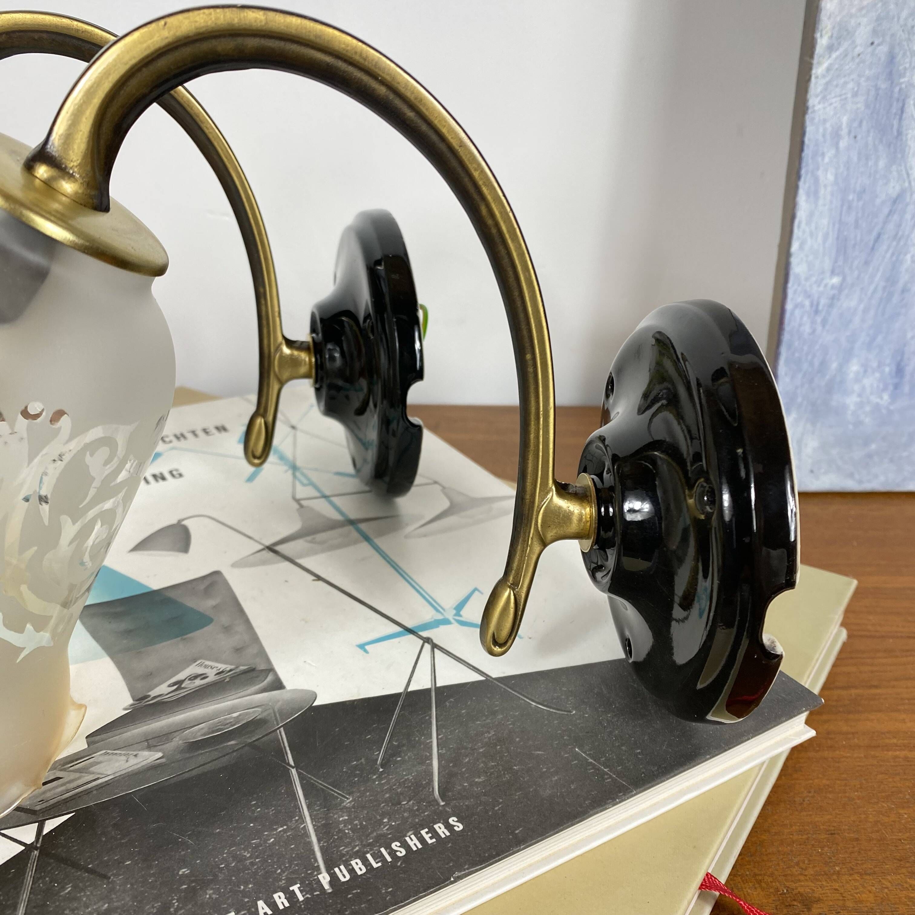Pair of brass swan neck wall sconces, glass tulips with screen printing.