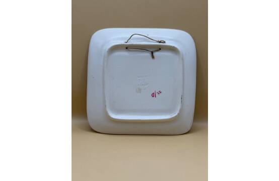 Decorative ceramic plate with enamel decoration