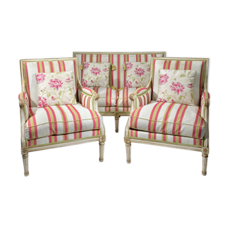 Louis XVI style lounge consisting of two armchairs and a 19th century sofa.