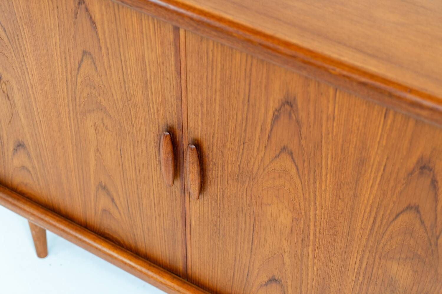 Svend Dyrlund teak sideboard with tambour doors (Denmark, 1960s).