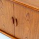 Svend Dyrlund teak sideboard with tambour doors (Denmark, 1960s).