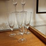 Six engraved crystal champagne flutes