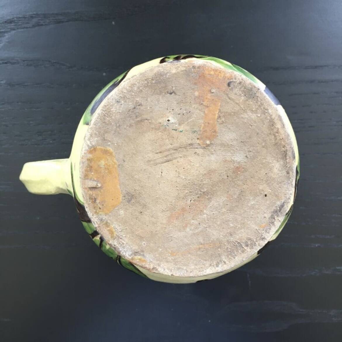 Antique pitcher of mixed earth