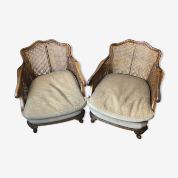 Paire de fauteuils bergères Louis XV cannées et velours