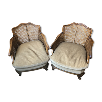 Paire de fauteuils bergères Louis XV cannées et velours