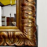 Gold-tinted wooden and stucco rectangular mirror - 1920
