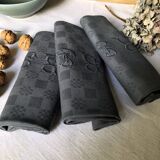Suite of four napkins tinted in smoke grey