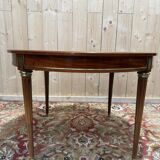 Round dining table with leather top in Louis XVI style.