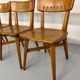 Set of 4 vintage solid oak chairs, 1960s design with sculpted backrest.