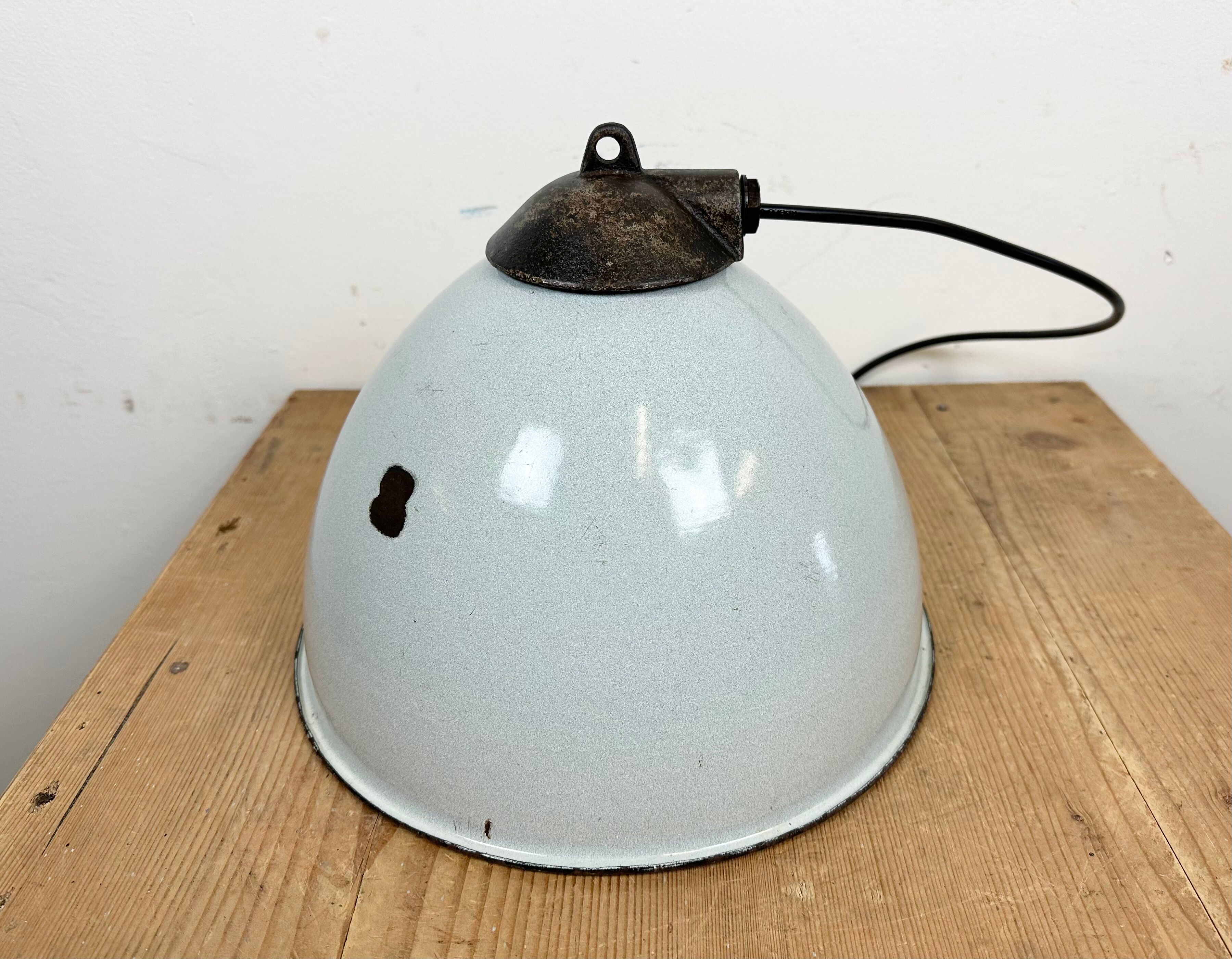 Industrial grey enamel factory lamp with cast iron top, 1960s
