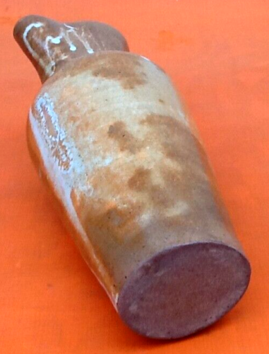 Glazed stoneware pitcher With white dripping on brown background Height: 270mm