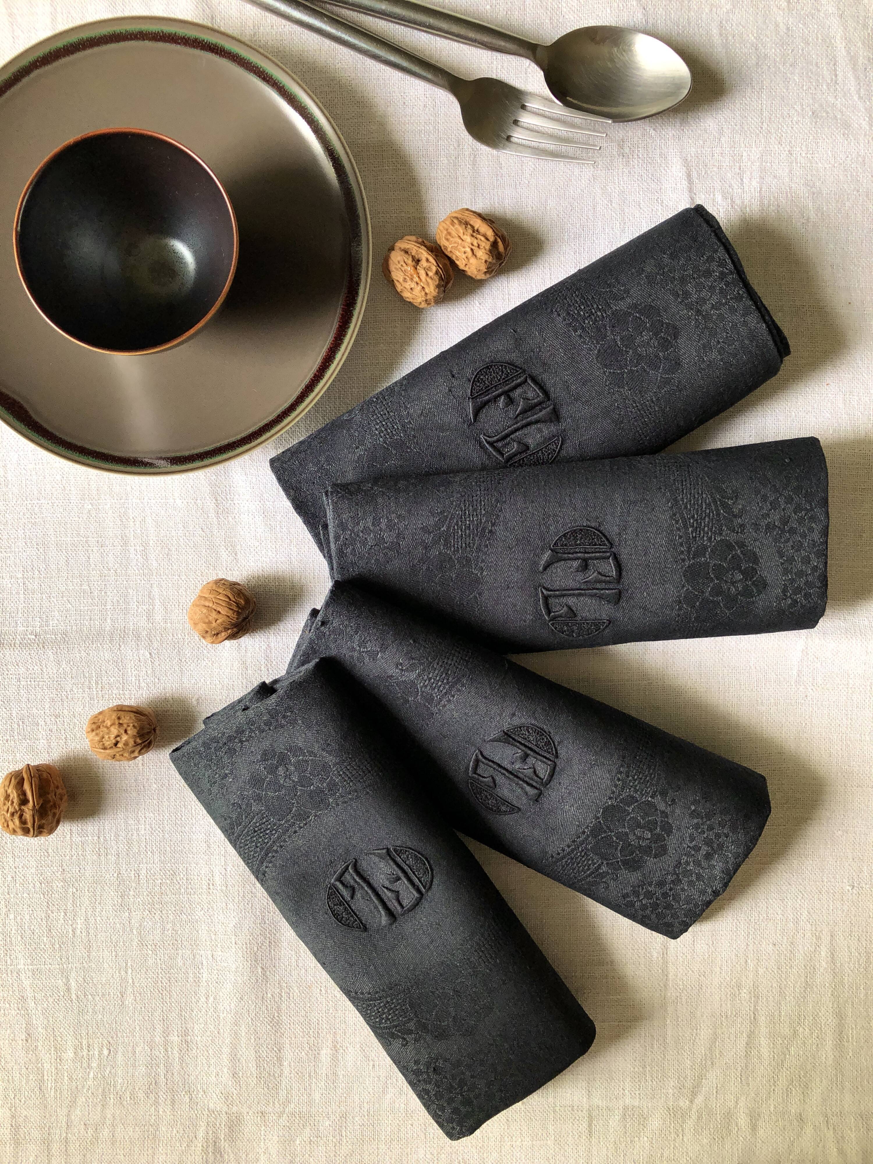 Set of four old damasked towels tinted black