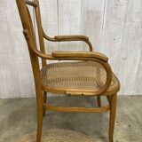 Curved wood and cane armchair