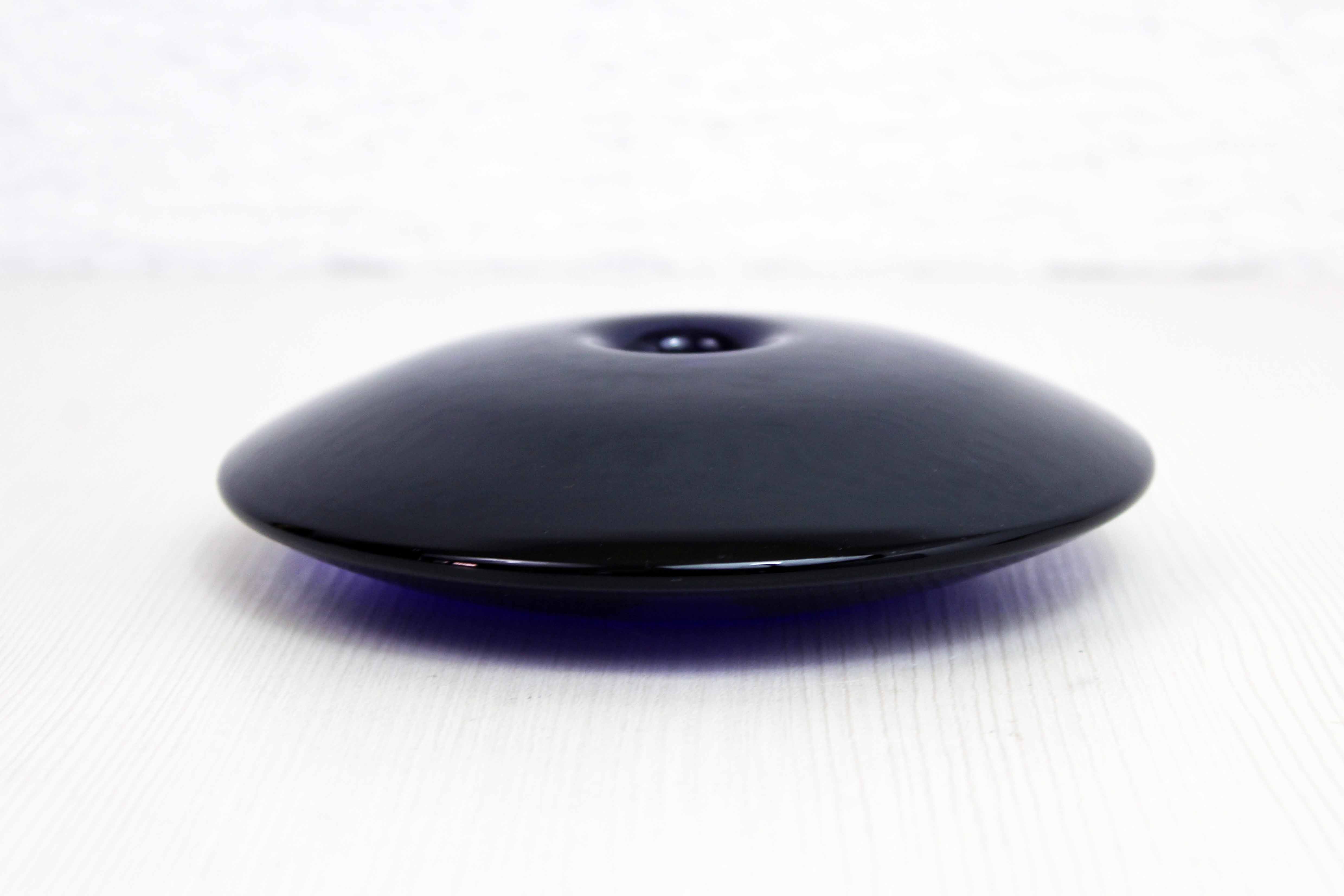 Blue glass saucer candle holder