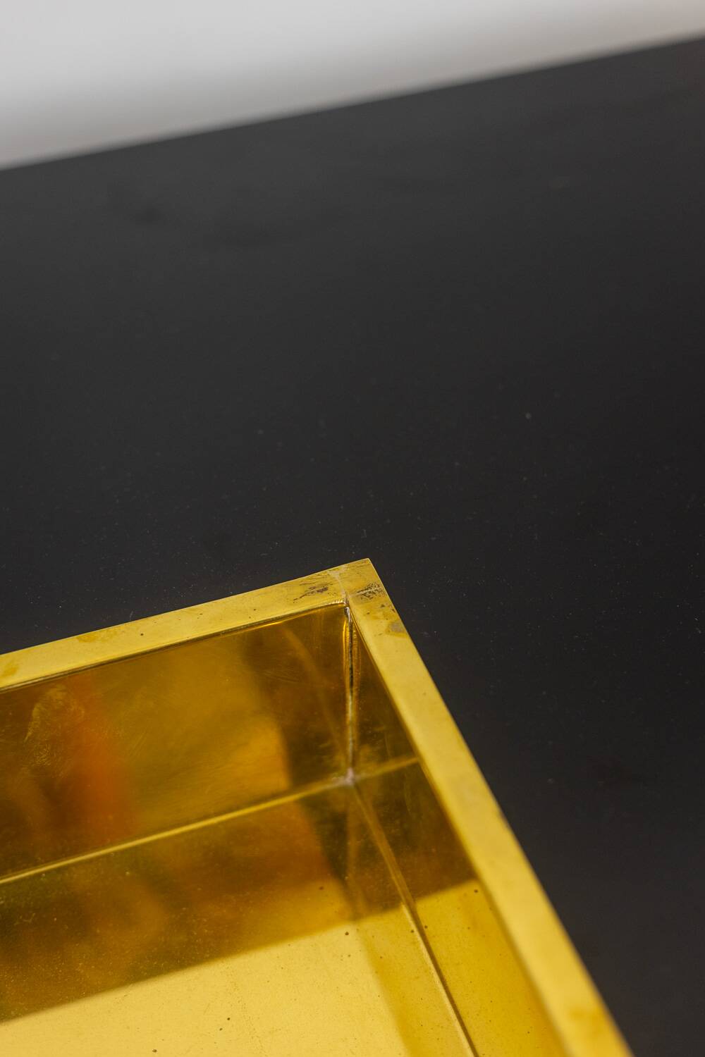 Willy Rizzo. Low table in black lacquered wood and gold brass. 1970s.