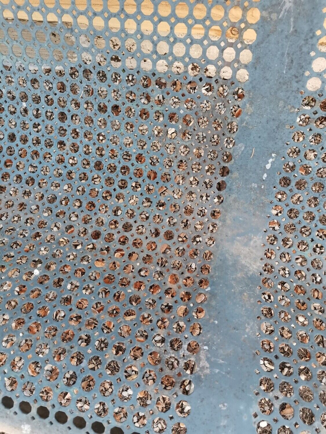 Former garden bench in perforated sheet metal