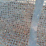 Former garden bench in perforated sheet metal