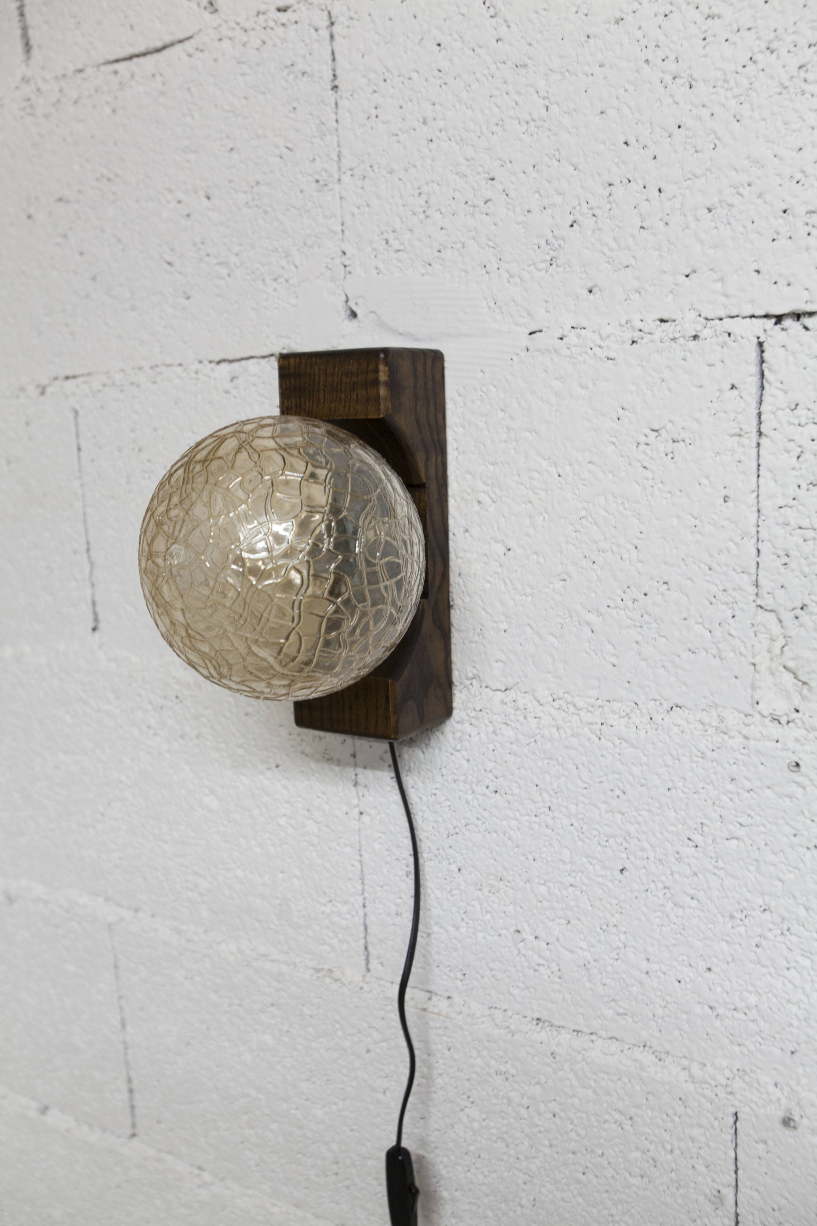 1960s ball wall light in dark wood and amber glass