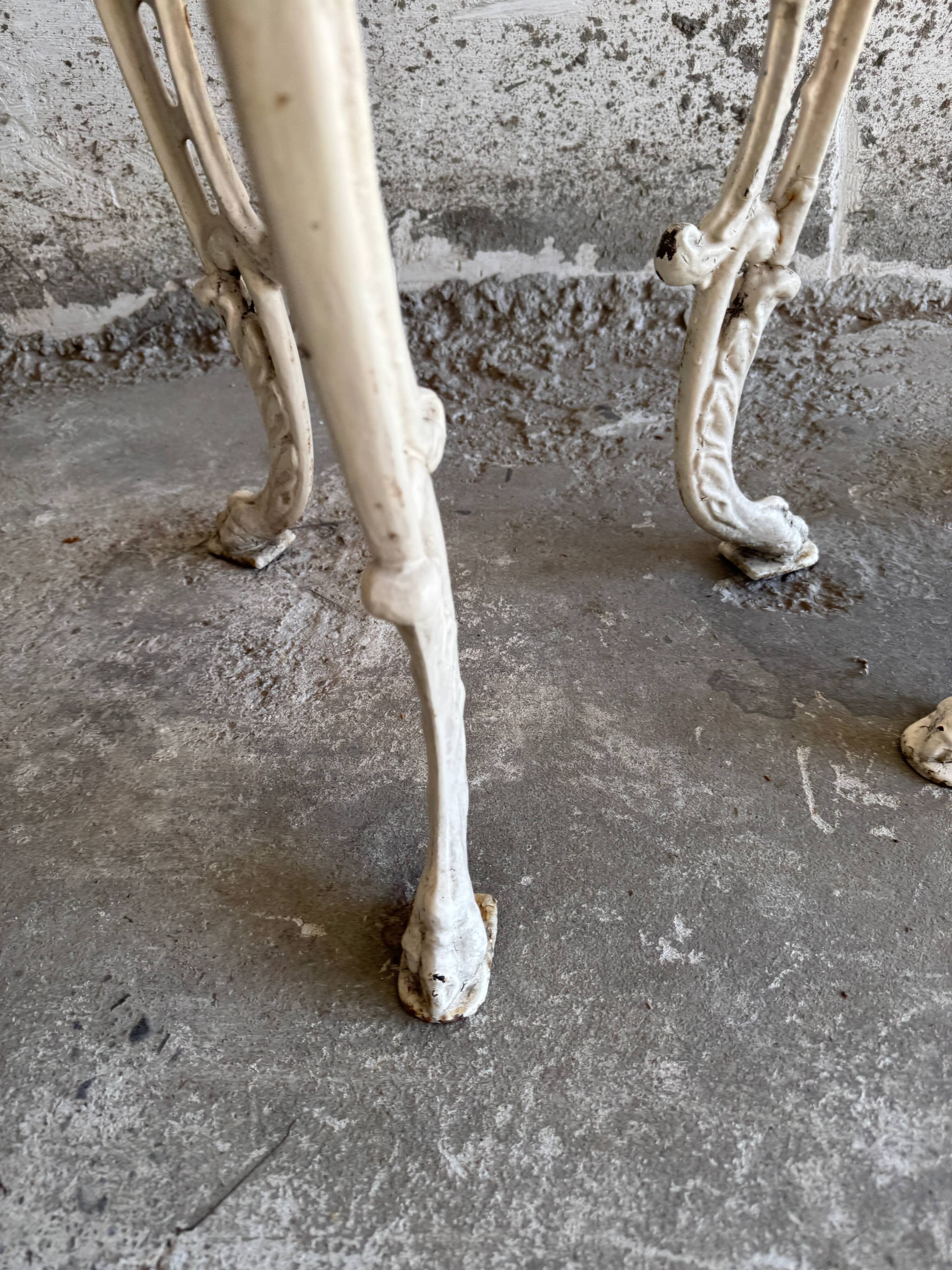 Pair of cream-white cast iron side tables with wooden tops — neoclassical shabby-chic