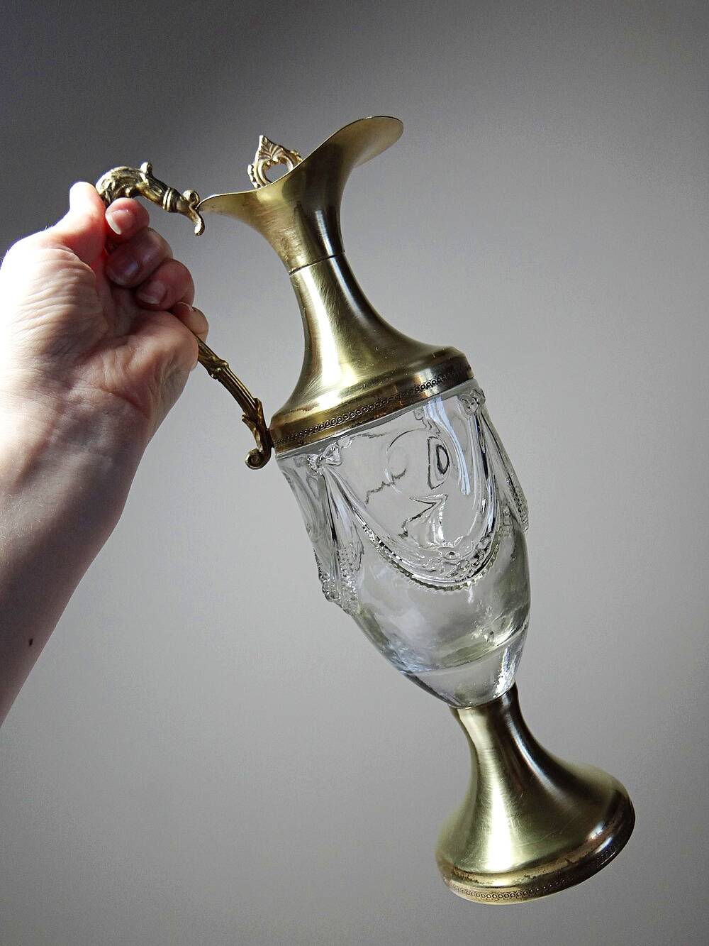 Vintage decorative jug in moulded glass and gilded brass, Italy circa 1980.