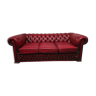 Three-seater red leather chesterfield sofa