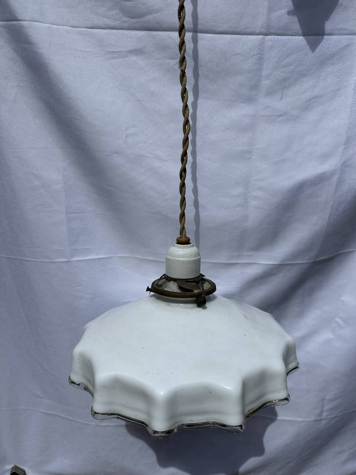 Vintage pleated opaline suspension with porcelain fittings.