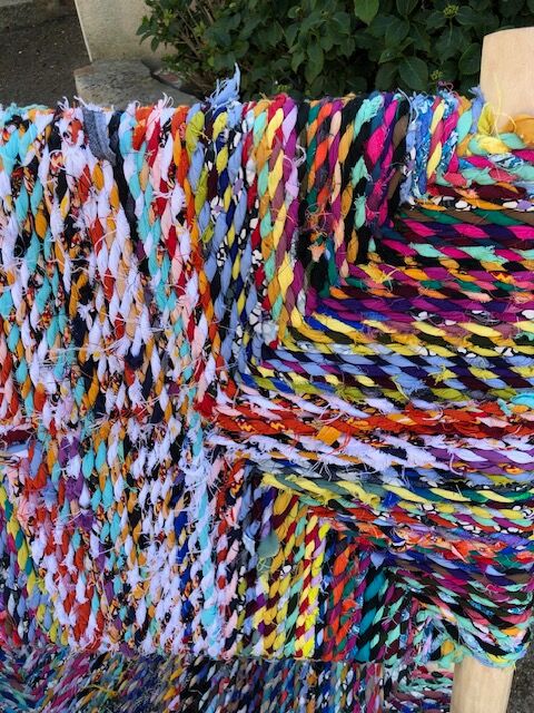 Wooden armchair braiding multicolored fabrics