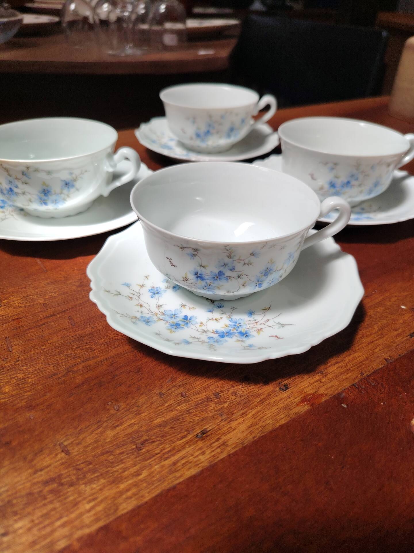 Set of 4 Limoges porcelain cups and saucers.