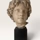 Plaster bust on a wooden base