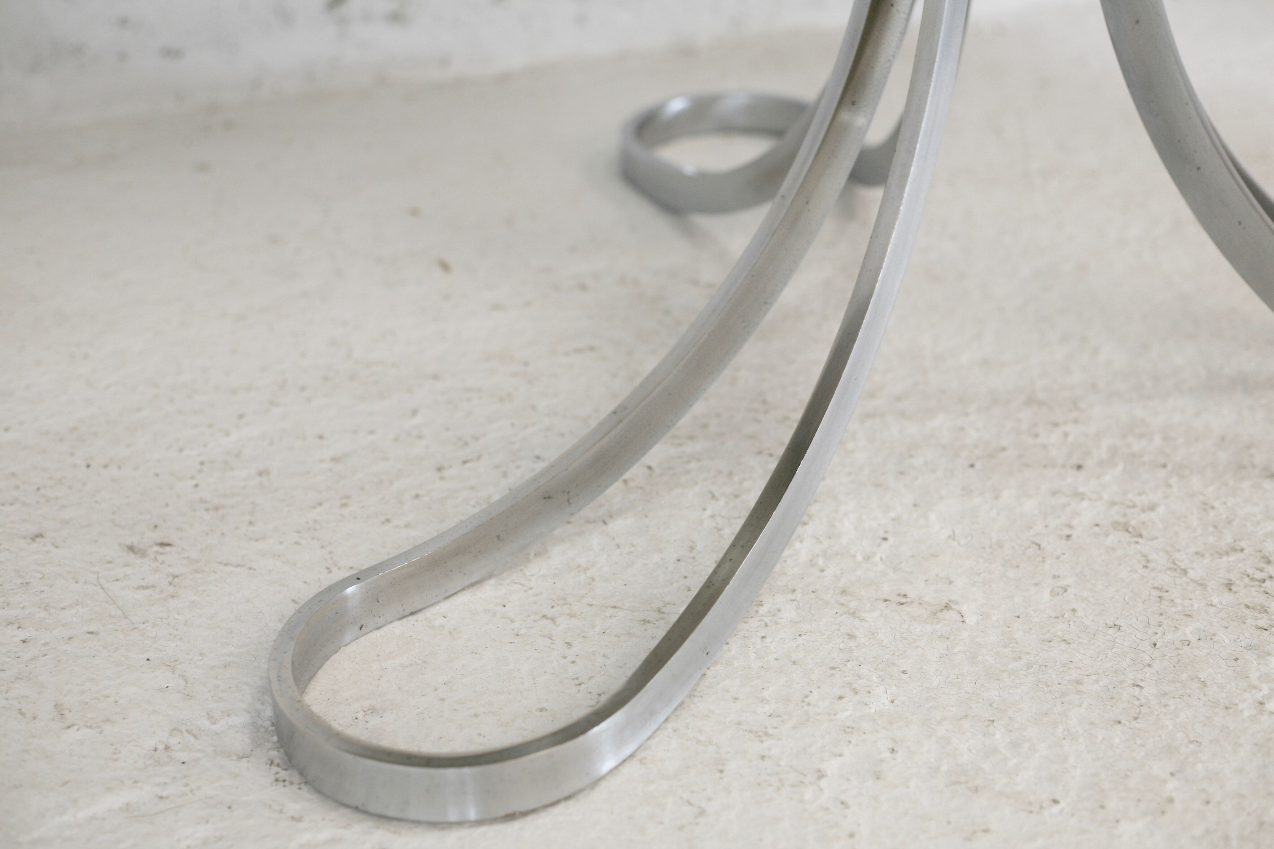 Living room table "Space Age" polished steel, circular slab smoked glass. France, circa 1970.