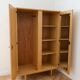 Vintage 1950s cabinet with tapered legs, wood.