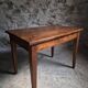 Old French table in cherry wood with bistro chair, circa 1900–1930.