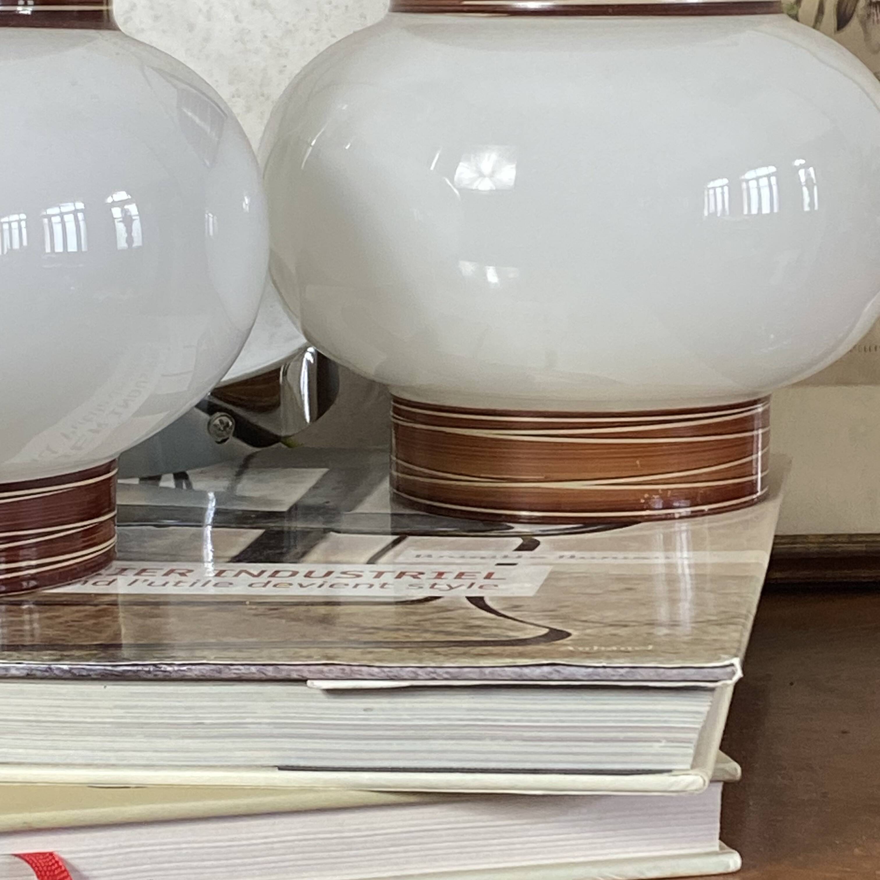 Pair of pendant lights with white glass shades from the 1950s.