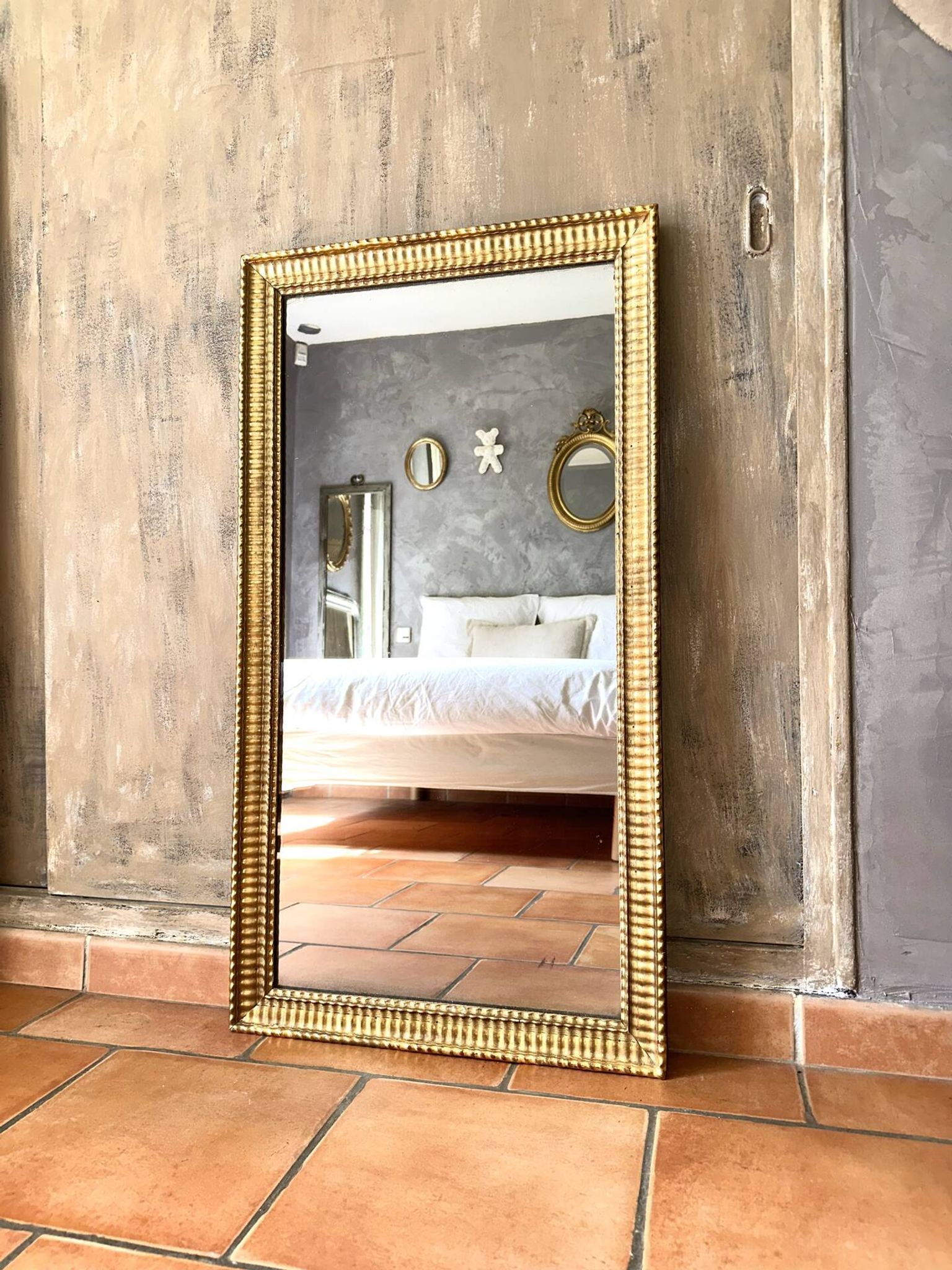 Antique Napoleon III gilded mirror from the 19th century.